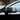 Side view of Tesla model Y Juniper with Carbon Fiber Mirror Caps installed - matte finish