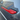 Tesla Model Y with red carbon fiber door handle cover installed