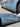 Left and right view of Real Carbon Fiber V-Style Side Skirts installed on Model 3