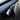 Blue glossy Carbon Fiber Turn Signal Stalk Covers installed on Tesla Model Y Juniper