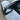 Front angle view of racing style mirror caps installed on a 2024–2026+ Tesla Model 3 Highland