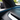 Tesla Model Y Juniper carbon fiber dashboard trim showing seamless integration with the interior ambient light strip