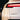 Black cyber-style Model Y lettering decal on a white Tesla tailgate below the taillight