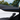 Carbon fiber door trim covers installed on Tesla Model Y Juniper with blue ambient lighting and white interior