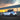 Tesla Model Y Juniper with Dragon Flame Pro full aero body kit shown from the side rear while driving