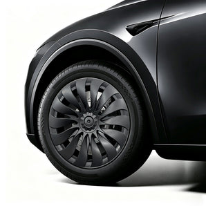 Close-up of 18-inch turbine-style wheel cover installed on Tesla Model Y Standard