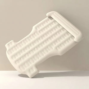 Off-white custom-fit air mattress with raised side pillows and bubble-texture surface