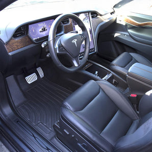 Installed black all-weather floor mats in front footwell of electric SUV