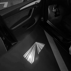 Striped geometric logo puddle light projection on car floor area