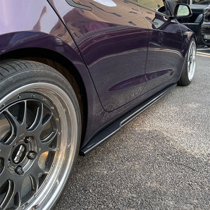 Side view of Carbon Fiber Side Skirts installed on 2024+ Tesla Model 3
