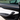 Side view of Tesla Model Y Juniper carbon fiber door trim covers installed above the white door panel