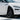 Front wheel arch trim on white Tesla Model Y Juniper with driver door open