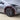 Red outline highlighting the front wheel arch trim position on Tesla Model Y Juniper
