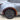Highlighted rear wheel arch trim installation area on a silver Tesla Model Y Juniper