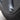 Black aluminum tire valve stem cap on a Tesla wheel.