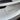 Close-up of a black cyber-style Model 3 lettering decal on a white Tesla rear trunk