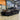 Installed carbon fiber front lip splitter on a dark-colored Tesla Model 3 Highland Performance