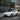 Tesla Model Y Juniper with Dragon Flame Pro front lip and side skirts in front three-quarter view