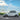 Side profile of Tesla Model Y Juniper highlighting Dragon Flame Pro side skirts and rear spoiler