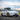 Tesla Model Y Juniper with Dragon Flame Pro front lip and side skirts shown while driving