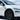 Front wheel arch trim on white Tesla Model Y Juniper showing black ABS exterior styling