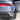 Rear three-quarter close-up of silver Tesla Model Y Juniper showing black wheel arch trim beside the rear bumper