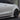 Tesla Model Y Juniper with REV body kit shown from rear while driving