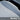 Close-up of white perforated leather seat covers with detailed stitching for Tesla Model Y L.